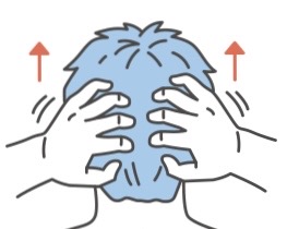 2.首筋を押し上げてコリをほぐす
